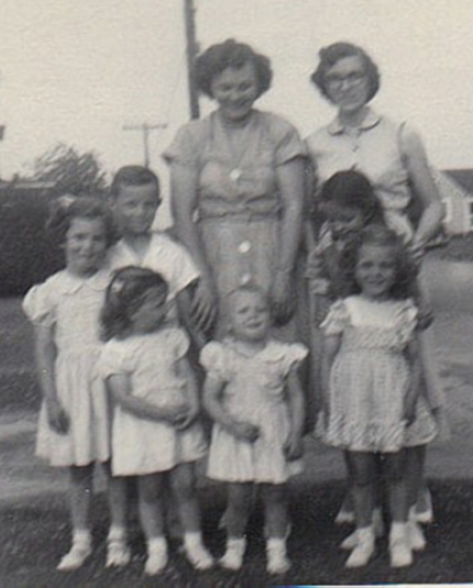 Nona and Esther Godwin Narron stand in the back. From left, Nona's children: Linda, Jimmy Jr. and Sandy; and Emma Lee Godwin Cayton's children Peggy, Janie, with Nancy behind her.